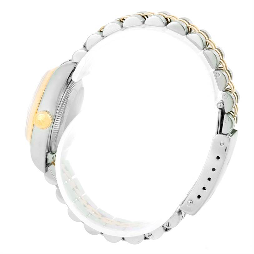 The watch is a Rolex Datejust 69173 Women
s Stainless Steel Champagne Dial 69173 Women
s Stainless Steel Champagne Dial model shown from the right side, highlighting the crown and bracelet.