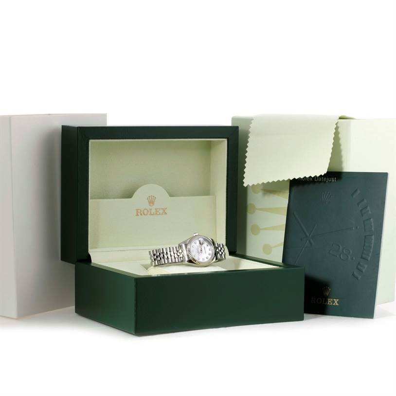 The image shows a Rolex Datejust 179174 Women's Stainless Steel Mother of Pearl Dial 179174 Women's Stainless Steel Mother of Pearl Dial watch placed in an open green watch box, along with a booklet and a cleaning cloth.