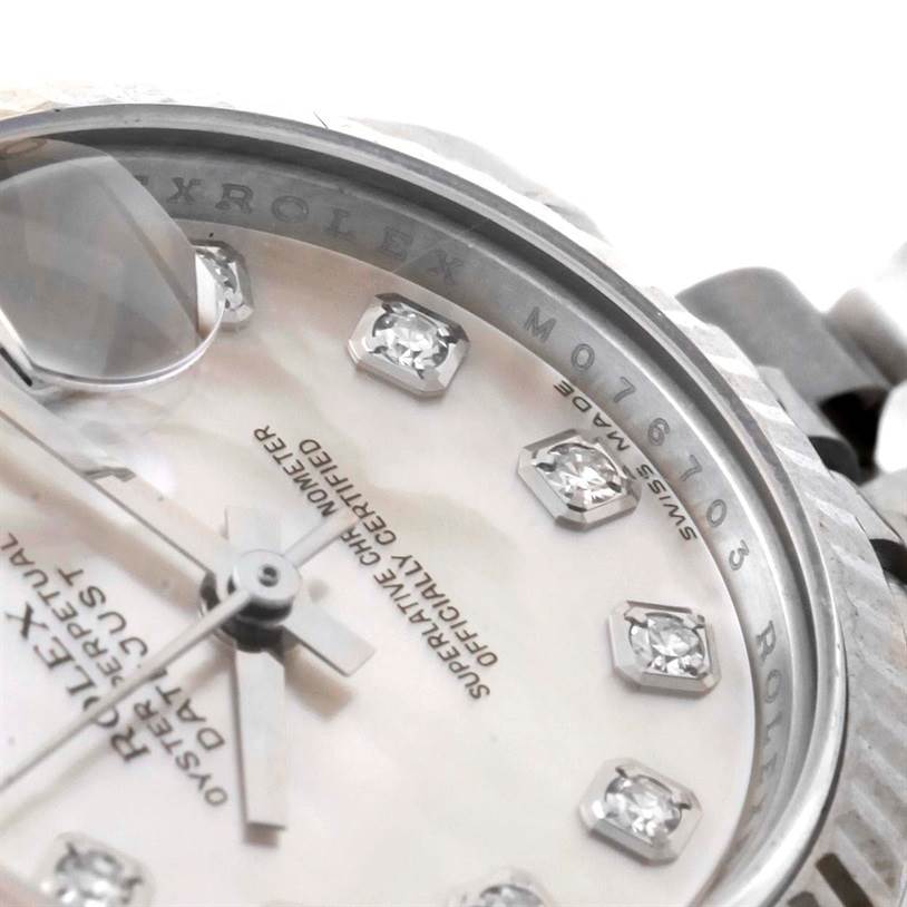 This image shows a close-up of the dial and bezel of the Rolex Datejust 179174 Women's Stainless Steel Mother of Pearl Dial 179174 Women's Stainless Steel Mother of Pearl Dial watch, highlighting the diamond hour markers and cyclops lens.