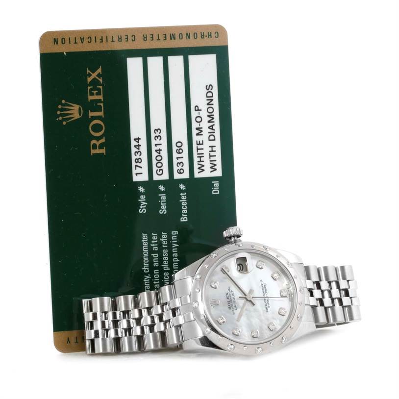 The Rolex Mid-Size 178344 Women's Stainless Steel Mother of Pearl Dial 178344 Women's Stainless Steel Mother of Pearl Dial watch is shown at an angle displaying the face, bracelet, and accompanying certification card.