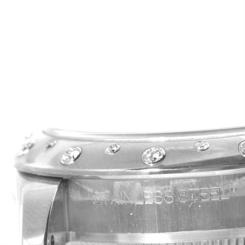 This close-up image of the mid-size Rolex watch shows the stainless steel bezel with embedded diamonds.
