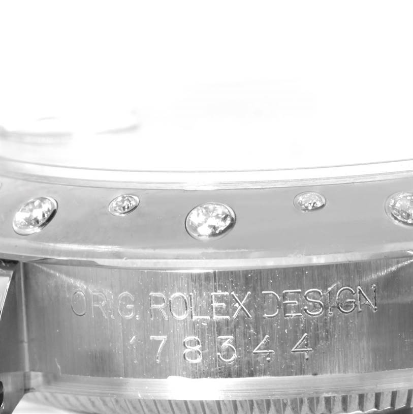 Close-up of the side view of the Rolex Mid-Size 178344 Women's Stainless Steel Mother of Pearl Dial 178344 Women's Stainless Steel Mother of Pearl Dial watch, showing engravings and diamond details on the bezel.