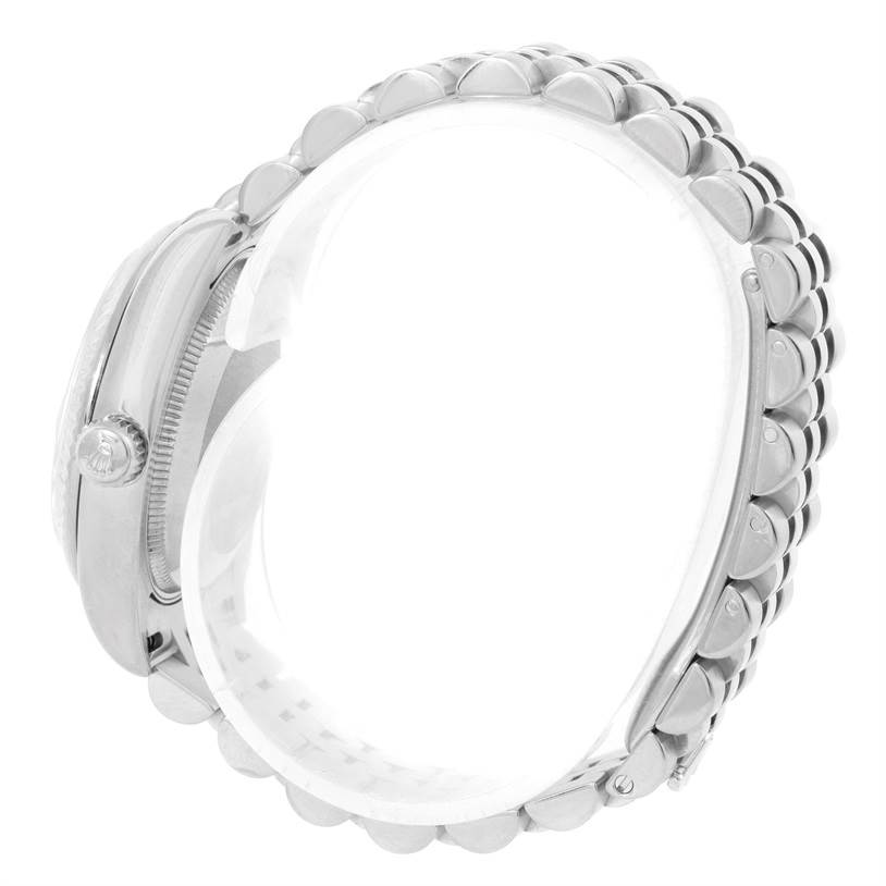 This image shows a side angle of a Rolex Mid-Size 178274 Women
s Stainless Steel Silver Dial 178274 Women
s Stainless Steel Silver Dial watch, emphasizing the crown, bezel, and metal bracelet.