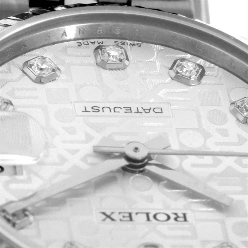 The close-up image of the mid-size Rolex watch shows the dial, hands, diamonds, and part of the bezel.
