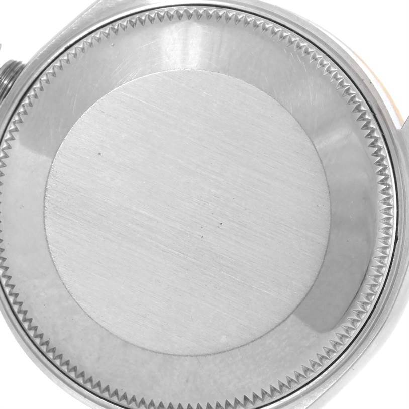 This image shows the case back of a Mid-Size Rolex watch from a top-down angle.