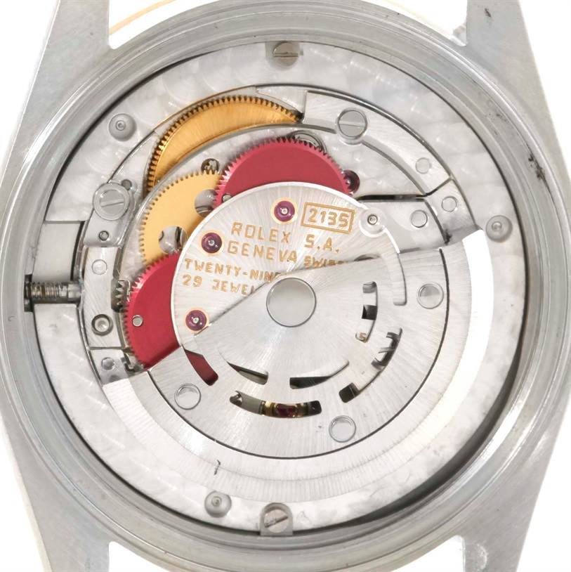 This image shows the internal movement mechanism of a Rolex Mid-Size 68273 Women's Steel and Gold (two tone) Blue Dial 68273 Women's Steel and Gold (two tone) Blue Dial watch model, specifically its gears and other intricate components.
