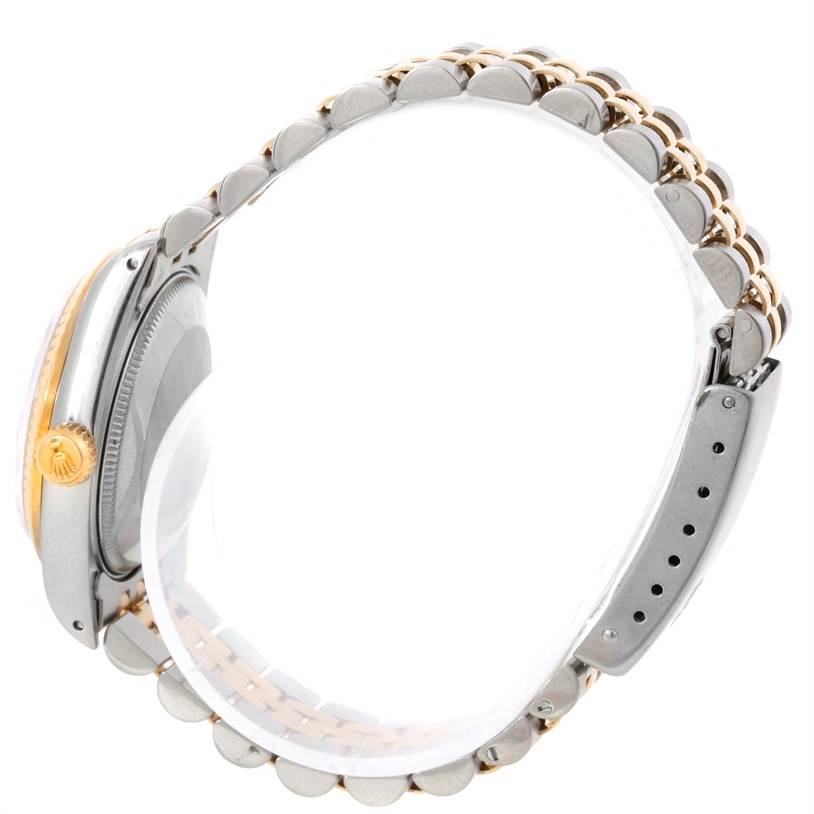 The image shows a side view of a Mid-Size Rolex watch, highlighting the bezel, crown, and bracelet.