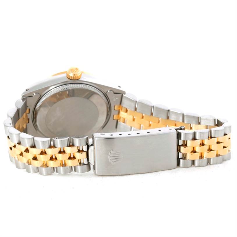 The image shows the back side of a Mid-Size Rolex watch, highlighting the case back, crown, and the two-tone metal bracelet.