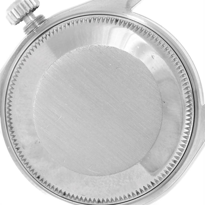 The image shows the back case and winding crown of a Mid-Size Rolex watch.