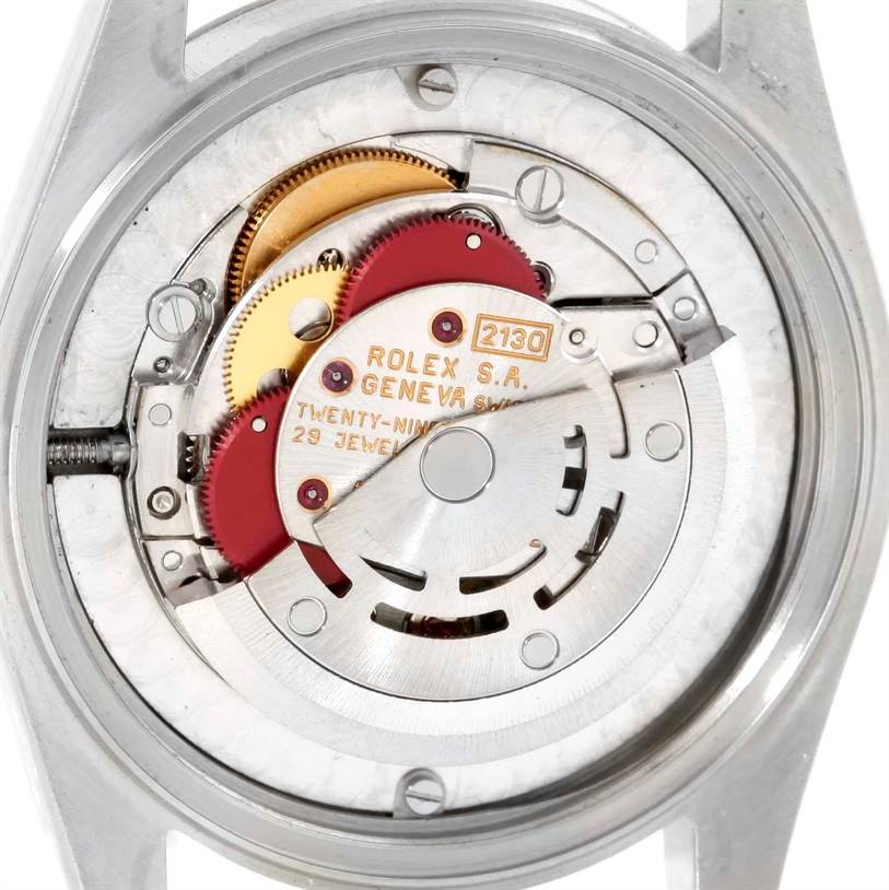 This image shows the movement mechanism of a Mid-Size Rolex watch, viewed from the back with the case removed.