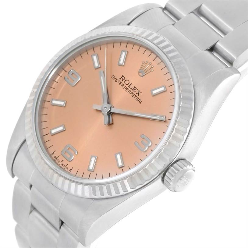 The image shows a close-up front angle of the Rolex Mid-Size 67514 Women's Stainless Steel Pink Dial 67514 Women's Stainless Steel Pink Dial Oyster Perpetual watch, highlighting its dial, bezel, and bracelet.