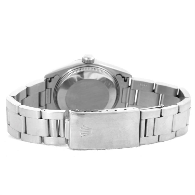 This image shows the back view of a Rolex Mid-Size 67514 Women's Stainless Steel Pink Dial 67514 Women's Stainless Steel Pink Dial watch, highlighting the case, crown, and bracelet with clasp.