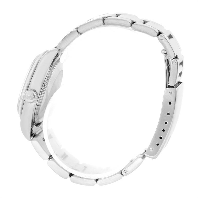 This image shows a side view of a Mid-Size Rolex watch, displaying the crown and bracelet.