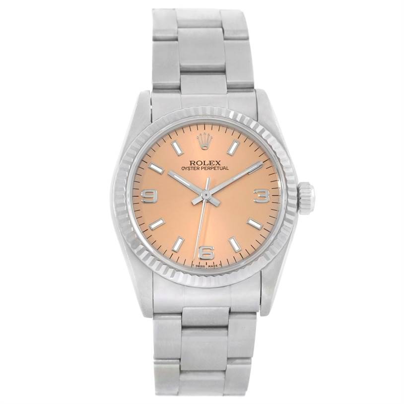 The image shows a front view of a Rolex Oyster Perpetual Mid-Size watch with a peach dial and silver bracelet.