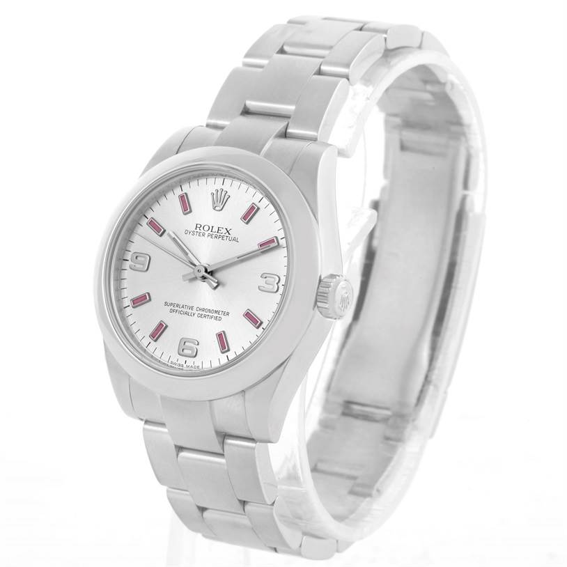 The image shows a side and front view of the Mid-Size Rolex Oyster Perpetual watch, displaying the bracelet and dial.