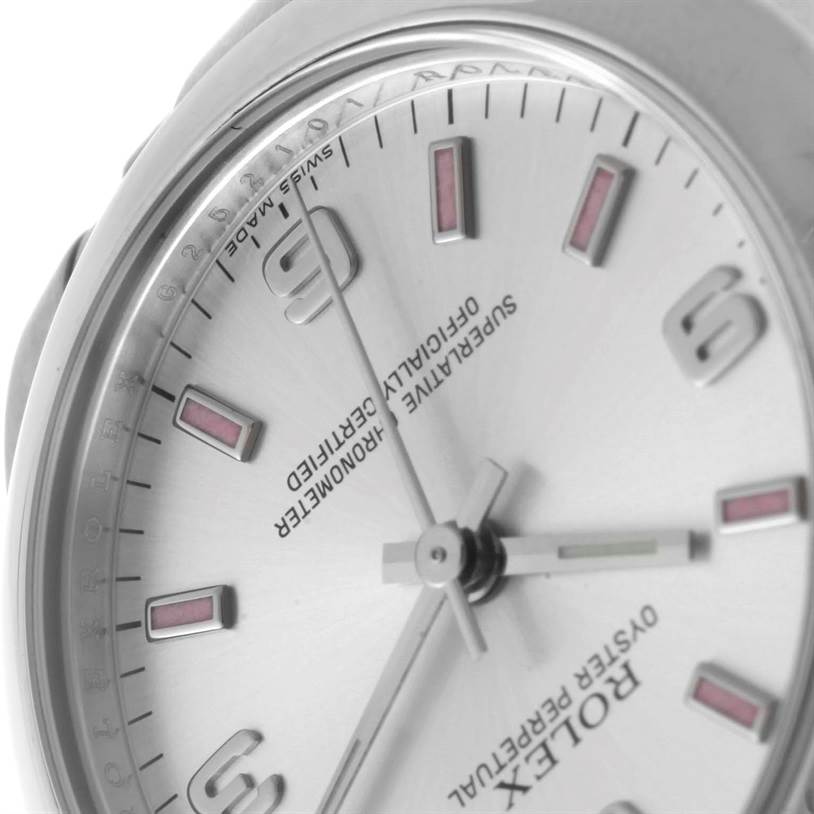 The image shows a close-up angle of the dial and part of the case of a Mid-Size Rolex watch.