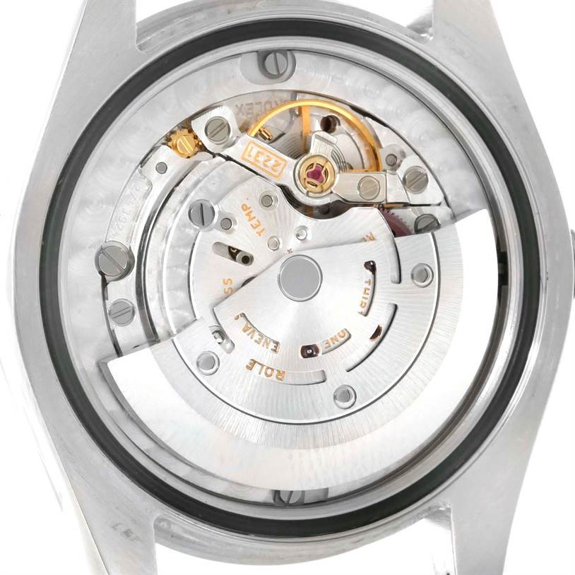 This image shows the intricate internal movement mechanism of a Rolex Mid-Size 177200 Women's Stainless Steel Pink Dial 177200 Women's Stainless Steel Pink Dial watch from a rear angle.