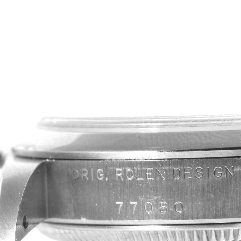 The image shows a close-up side view of the case of a Mid-Size Rolex watch, displaying "Orig. Rolex Design 77080" engraved on it.