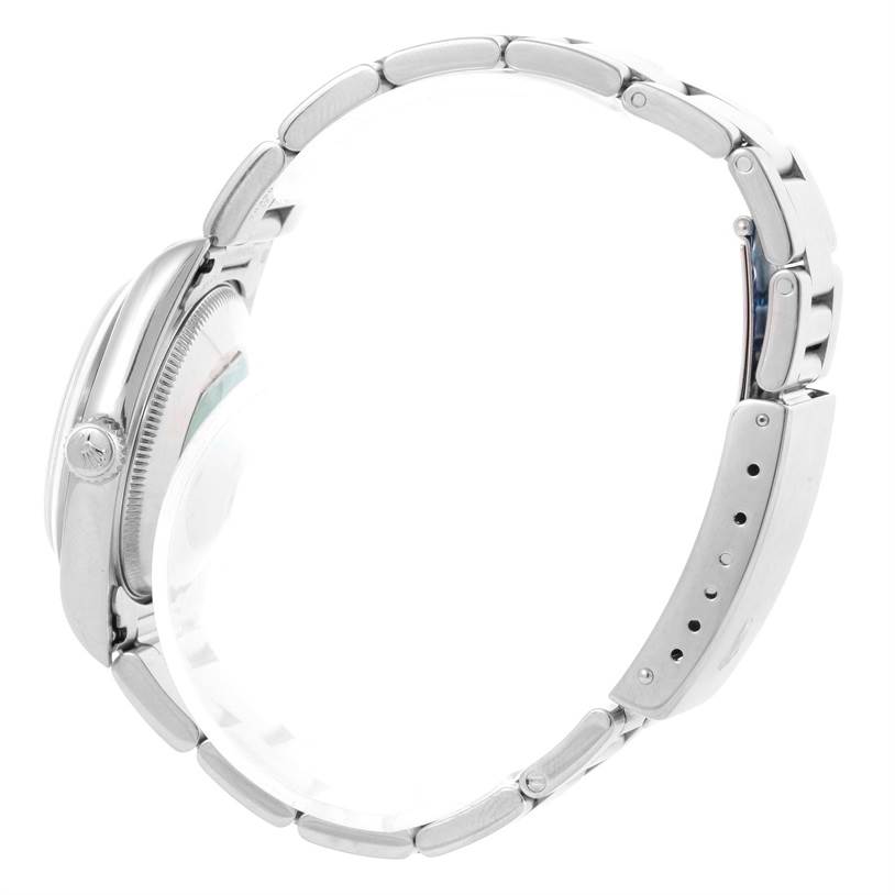 The image shows the side profile of the Rolex Mid-Size 77080 Women's Stainless Steel Black Dial 77080 Women's Stainless Steel Black Dial watch, highlighting its bracelet, crown, and case.