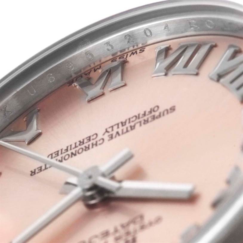 This close-up angle shows the face, Roman numerals, hands, and part of the bezel of the Mid-Size Rolex watch.