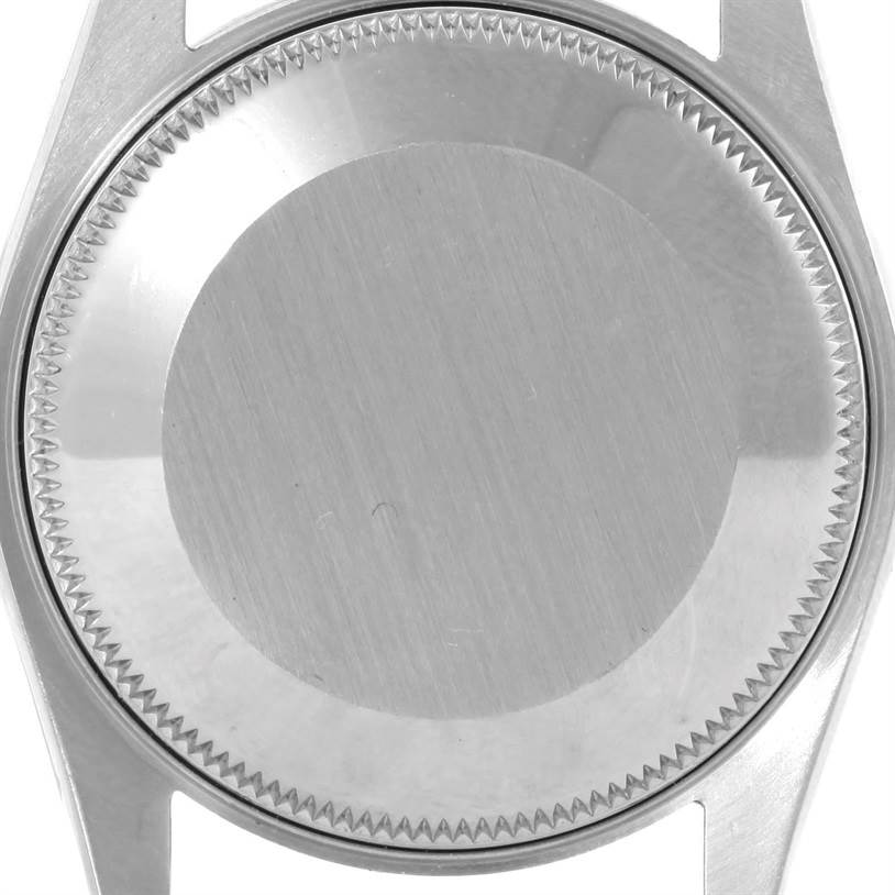 This image shows the case back, bezel, and lugs of a Rolex Mid-Size 67480 Women's Stainless Steel Black Dial 67480 Women's Stainless Steel Black Dial model from a top-down angle.