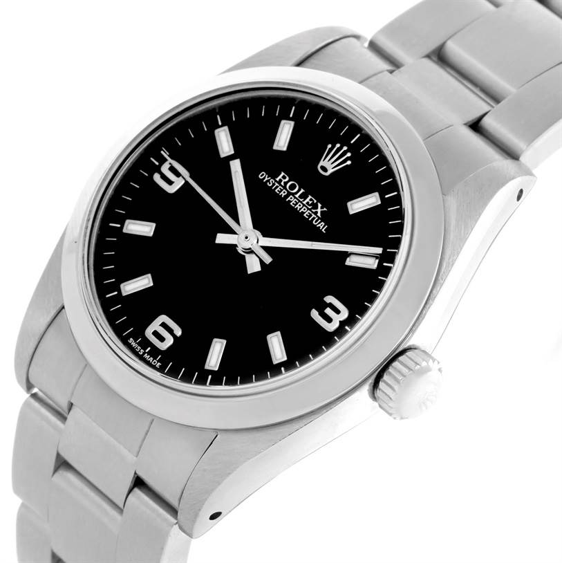 This image shows a side angle of the Rolex Mid-Size 67480 Women's Stainless Steel Black Dial 67480 Women's Stainless Steel Black Dial Oyster Perpetual watch, displaying its black dial, stainless steel case, and bracelet.