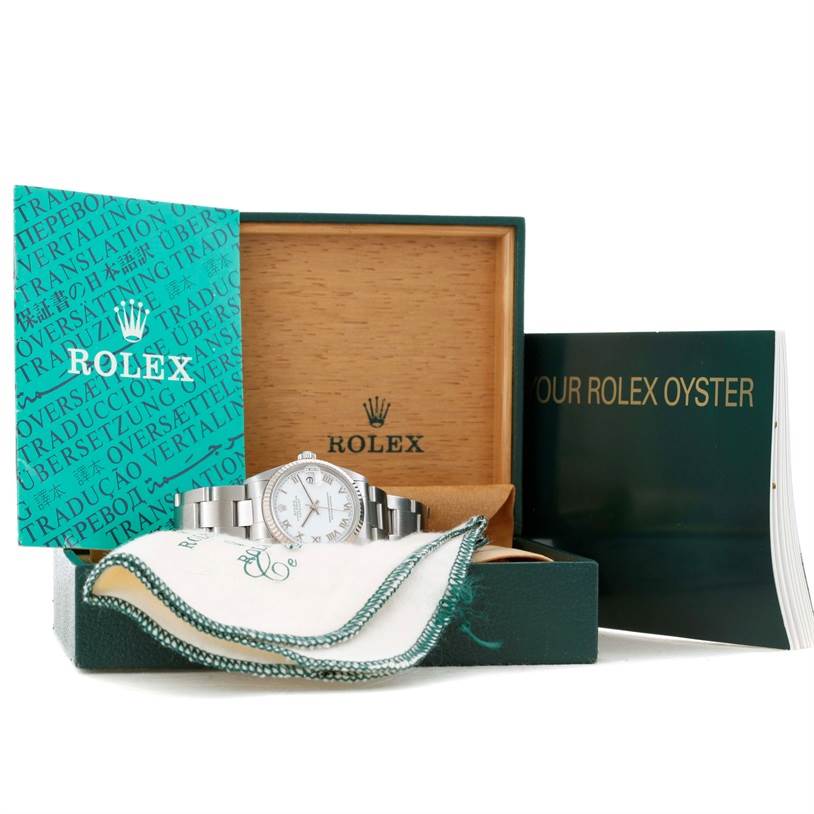 The Rolex Mid-Size 78274 Women's Stainless Steel White Dial 78274 Women's Stainless Steel White Dial watch is displayed front-on, with its box, manuals, and polishing cloth.