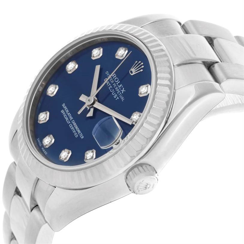 The image shows a close-up, angled view of a Rolex Datejust Mid-Size watch with a blue dial and diamond hour markers.