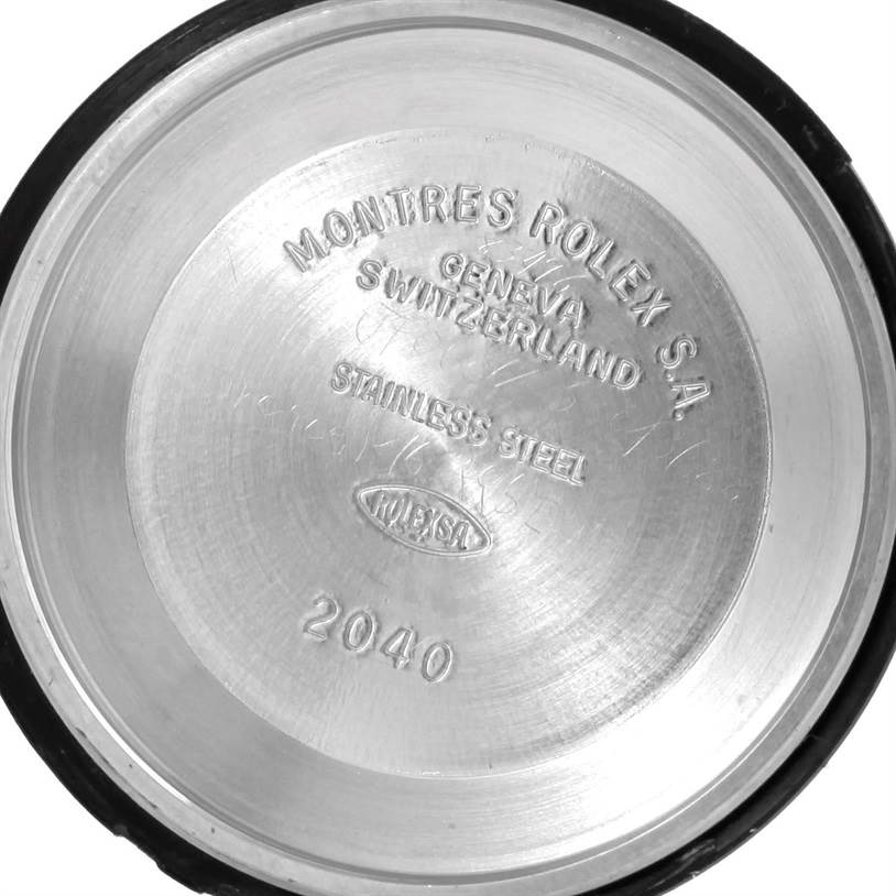 This image shows the inner case back of a Mid-Size Rolex watch, showing brand engravings and the model number 2040.
