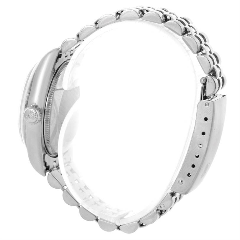 The image shows a side view of a Rolex Mid-Size 78240 Women's Stainless Steel Pink Dial 78240 Women's Stainless Steel Pink Dial watch, highlighting the bracelet and crown.