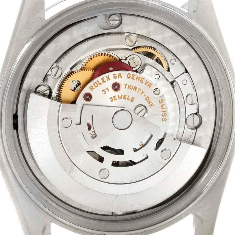 This image shows the internal movement mechanism of a Mid-Size Rolex watch viewed from the back.