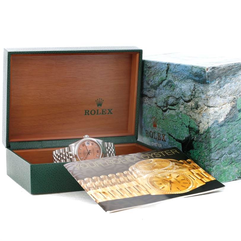 The Rolex Mid-Size 78240 Women's Stainless Steel Pink Dial 78240 Women's Stainless Steel Pink Dial watch is displayed inside an open box with the cover and a booklet partially visible.