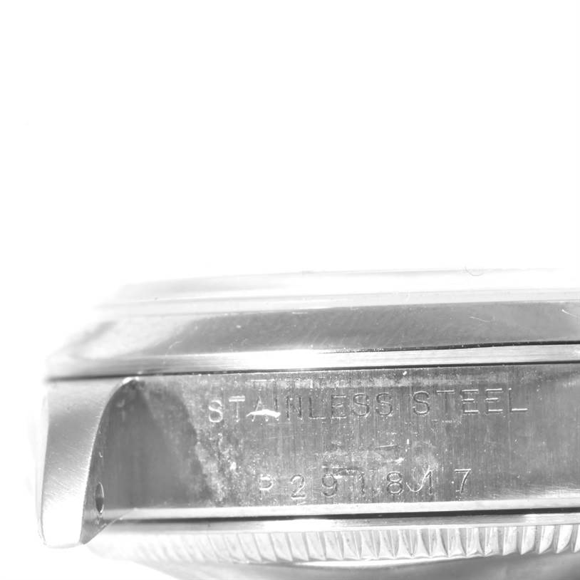 The image shows a side view of the stainless steel case of a Mid-Size Rolex watch.