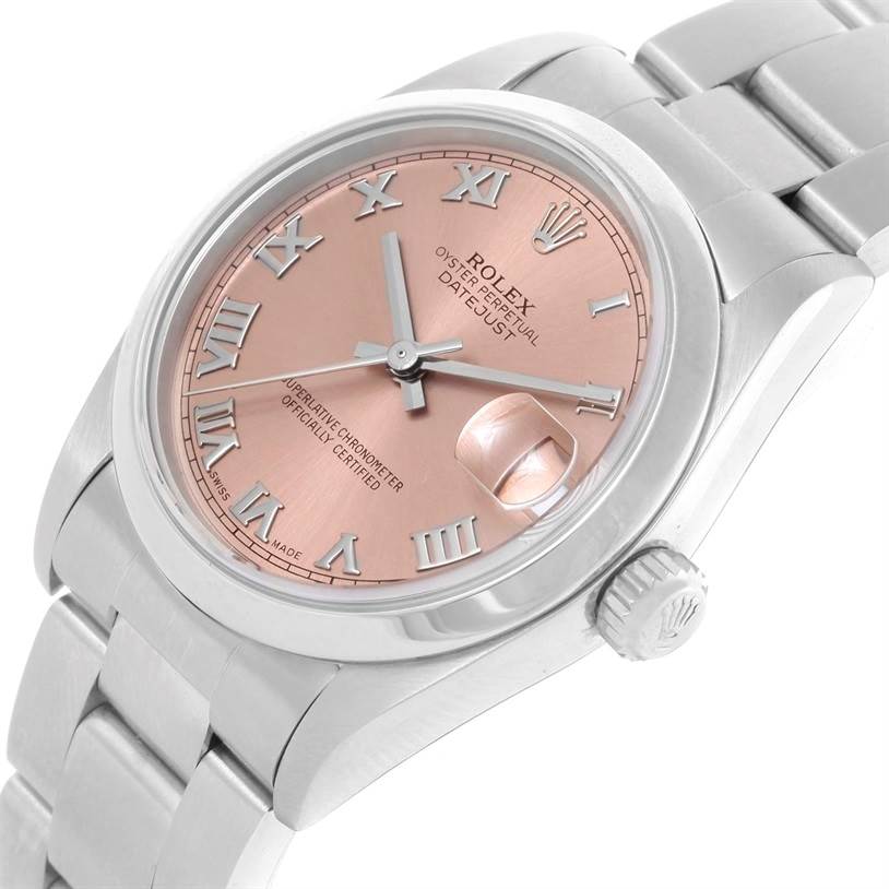 The image shows a side angle of a Rolex Mid-Size 78240 Women's Stainless Steel Pink Dial 78240 Women's Stainless Steel Pink Dial Oyster Perpetual Datejust with a pink dial, Roman numerals, and the crown.