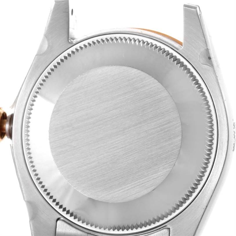 The image shows the back case of a Mid-Size Rolex watch, viewed from a straight angle.