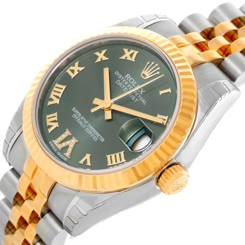 This image shows a close-up, side angle of a Rolex Mid-Size 178273 Women's Steel and Gold (two tone) Green Dial 178273 Women's Steel and Gold (two tone) Green Dial Oyster Perpetual Datejust, highlighting its green dial, gold-accented bracelet, and fluted bezel.