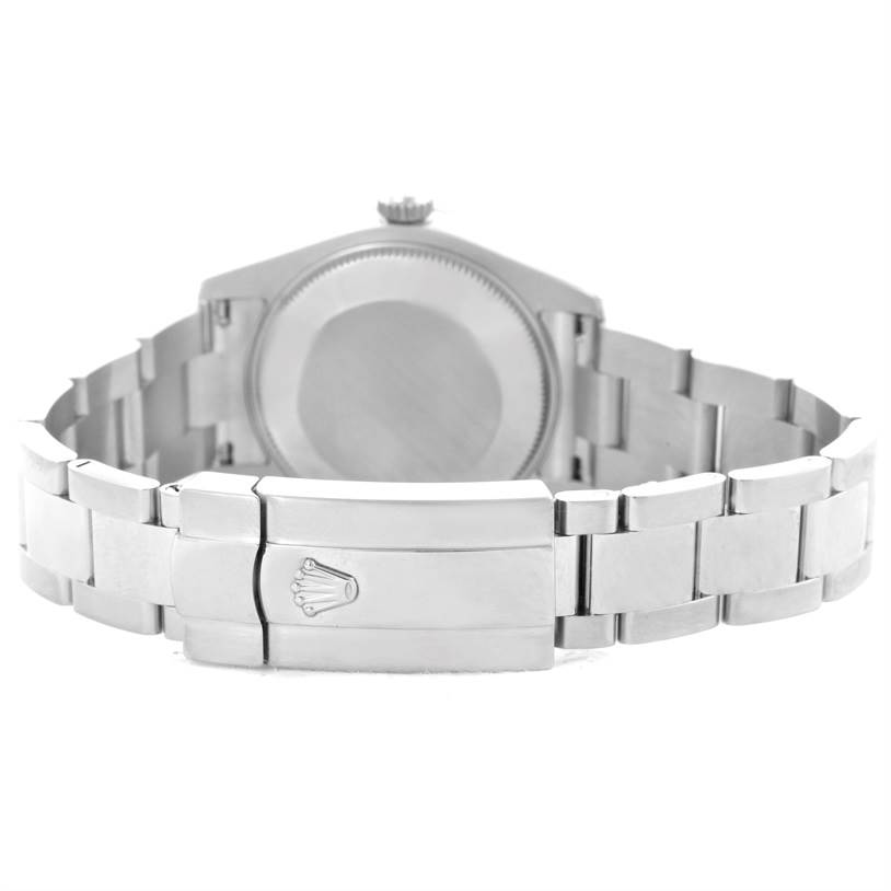 The image shows the back and bracelet clasp of a mid-size Rolex watch from a rear angle.