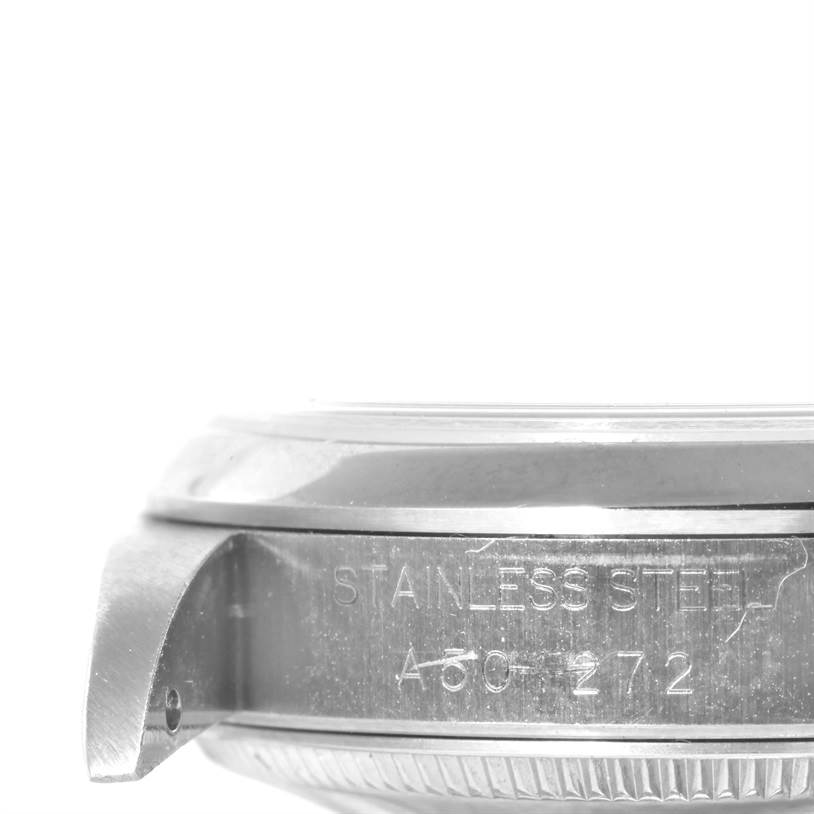 This image shows a close-up side view of a stainless steel case with engraved details on a Rolex Mid-Size 68240 Women's Stainless Steel Blue Dial 68240 Women's Stainless Steel Blue Dial model watch.