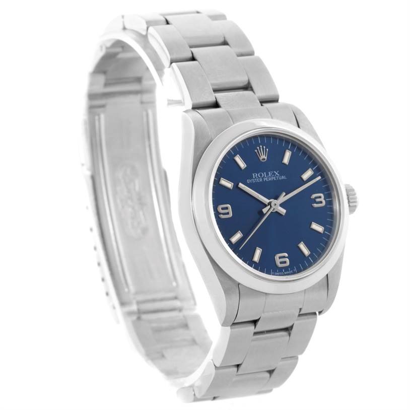 The Rolex Mid-Size 67480 Women's Stainless Steel Blue Dial 67480 Women's Stainless Steel Blue Dial model is shown from a side angle, displaying the face, bezel, crown, and bracelet.