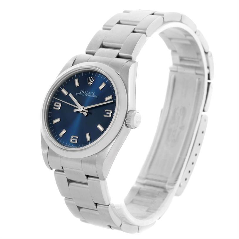 This image shows a Rolex Mid-Size 67480 Women's Stainless Steel Blue Dial 67480 Women's Stainless Steel Blue Dial watch at an angled side view, highlighting the dial, case, and bracelet.
