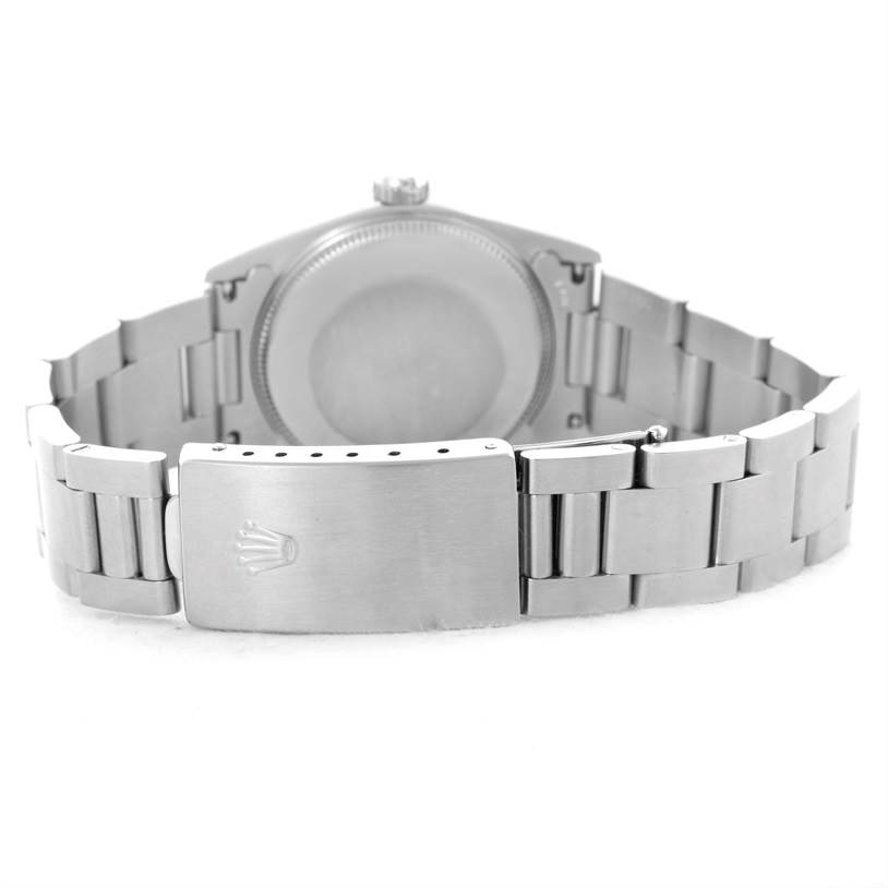 The image shows the back case and clasp of a Rolex Mid-Size 67480 Women's Stainless Steel Blue Dial 67480 Women's Stainless Steel Blue Dial model watch from a rear angle.