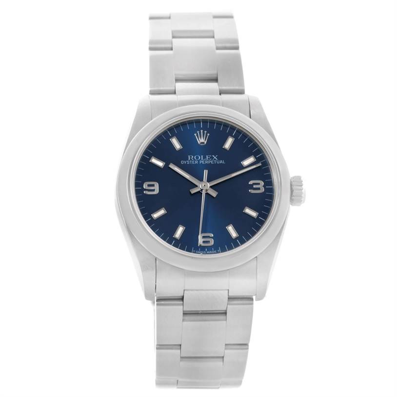 The image shows a front view of a Rolex Oyster Perpetual Mid-Size watch with a blue dial and silver bracelet.