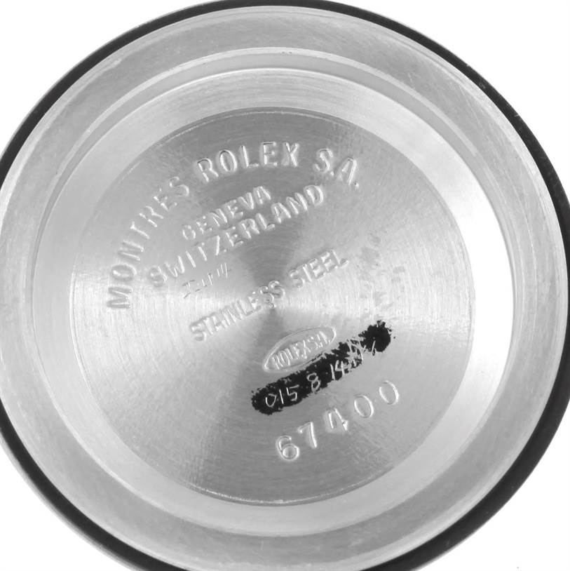 This image shows the inside case back of a Mid-Size Rolex watch, displaying model number 67400 and "Stainless Steel."