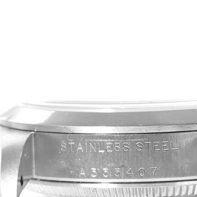 This image shows a close-up angle of the stainless steel case and engraving on a Rolex Mid-Size 77080 Men
s Stainless Steel Black Dial 77080 Men
s Stainless Steel Black Dial watch.