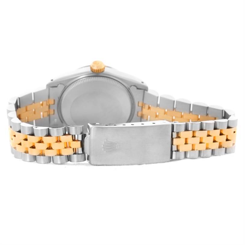 The image shows the backside of a Rolex Mid-Size 68273 Women's Steel and Gold (two tone) Champagne Dial 68273 Women's Steel and Gold (two tone) Champagne Dial model watch, highlighting the case back, clasp, and two-tone bracelet.