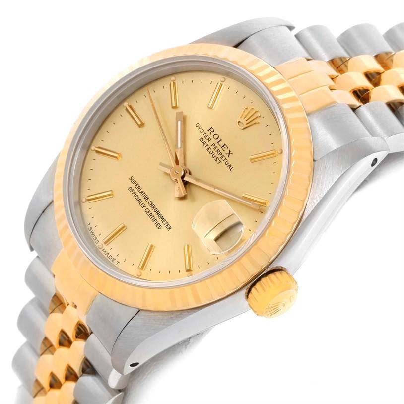 This image shows a gold and silver Rolex Mid-Size 68273 Women's Steel and Gold (two tone) Champagne Dial 68273 Women's Steel and Gold (two tone) Champagne Dial model watch at a slight angle, highlighting the face, bezel, crown, and part of the bracelet.