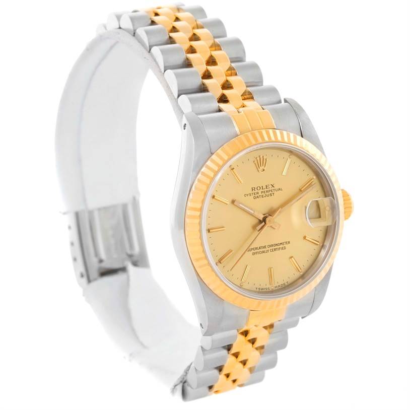 The Rolex Mid-Size 68273 Women's Steel and Gold (two tone) Champagne Dial 68273 Women's Steel and Gold (two tone) Champagne Dial Datejust watch is shown at an angled side view, highlighting the dial, bezel, and two-tone bracelet.