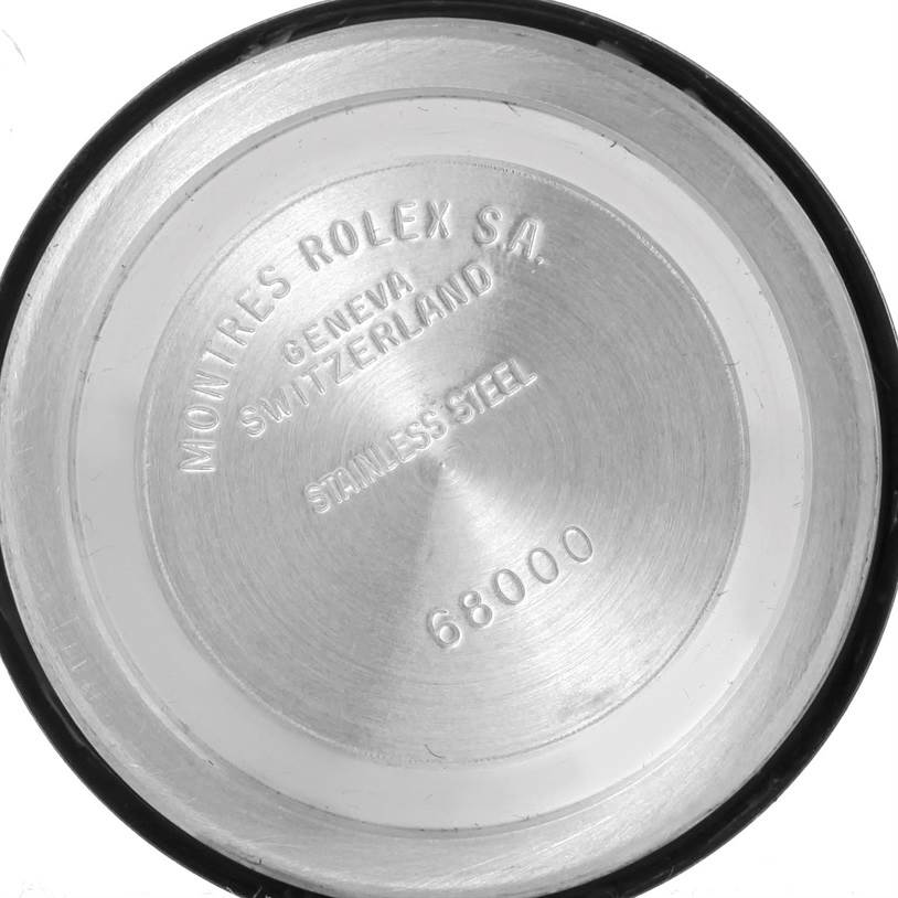 The image shows the interior back cover of a Mid-Size Rolex watch, displaying model number 68000 and "Stainless Steel" engraving.