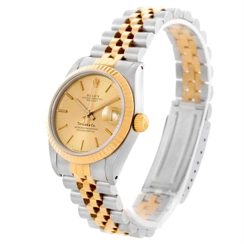 This image shows a Rolex Mid-Size 68273 Women's Steel and Gold (two tone) Champagne Dial 68273 Women's Steel and Gold (two tone) Champagne Dial model watch with a gold and silver bracelet, gold bezel, and a gold dial at a slight angle.