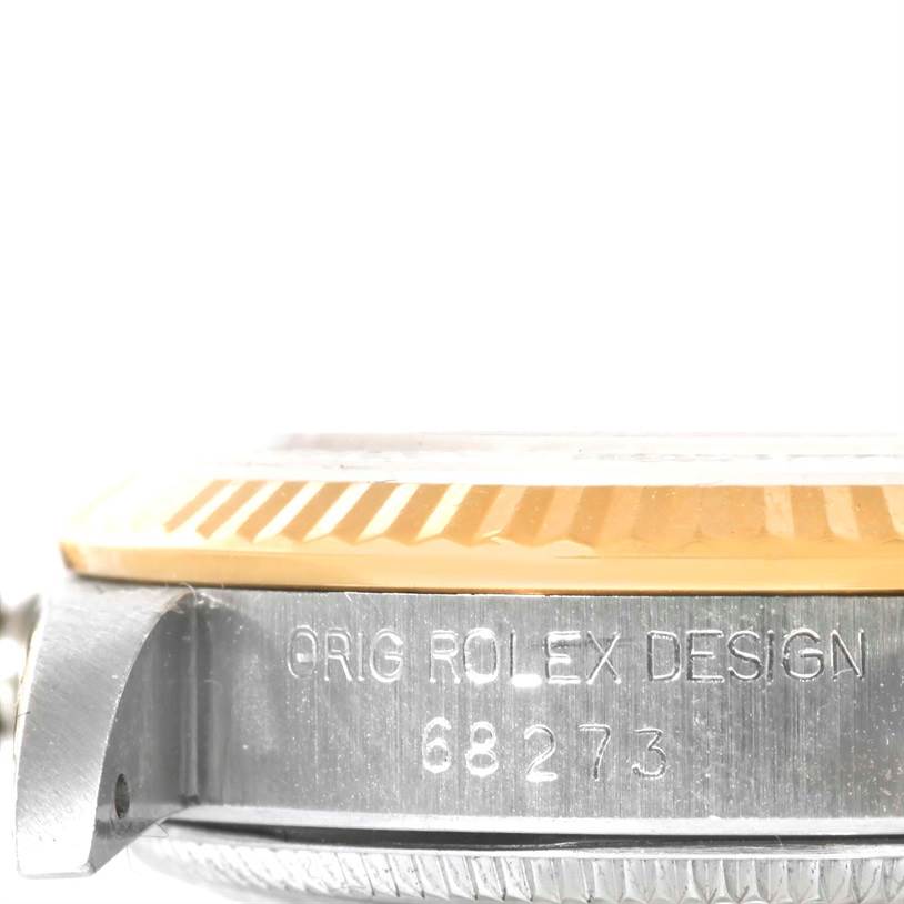 This image shows a side view of the bezel and case of a mid-size Rolex watch, focusing on the model number 68273.